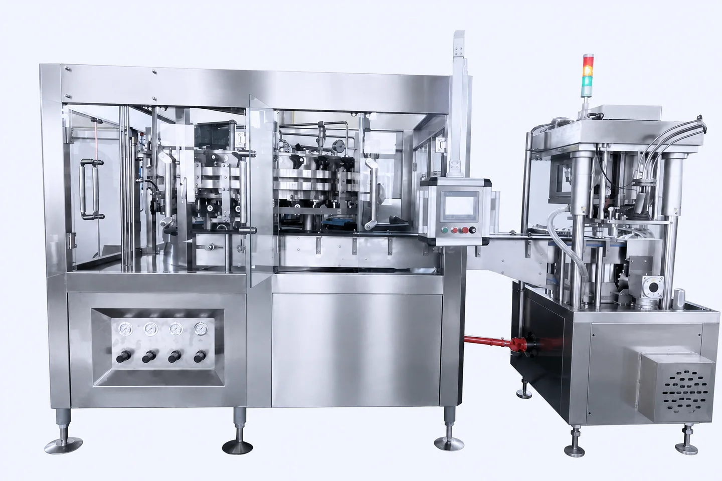 Front view of a stainless-steel can filler connected to a seaming station