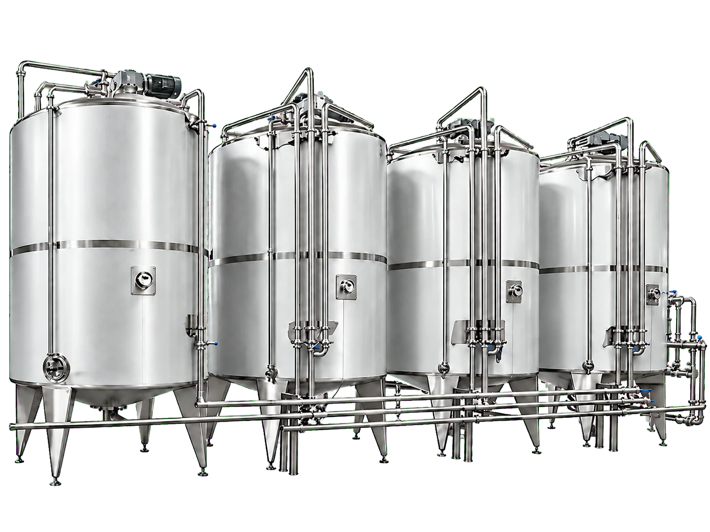 Row of stainless-steel syrup blending and storage tanks linked by process piping in a beverage plant