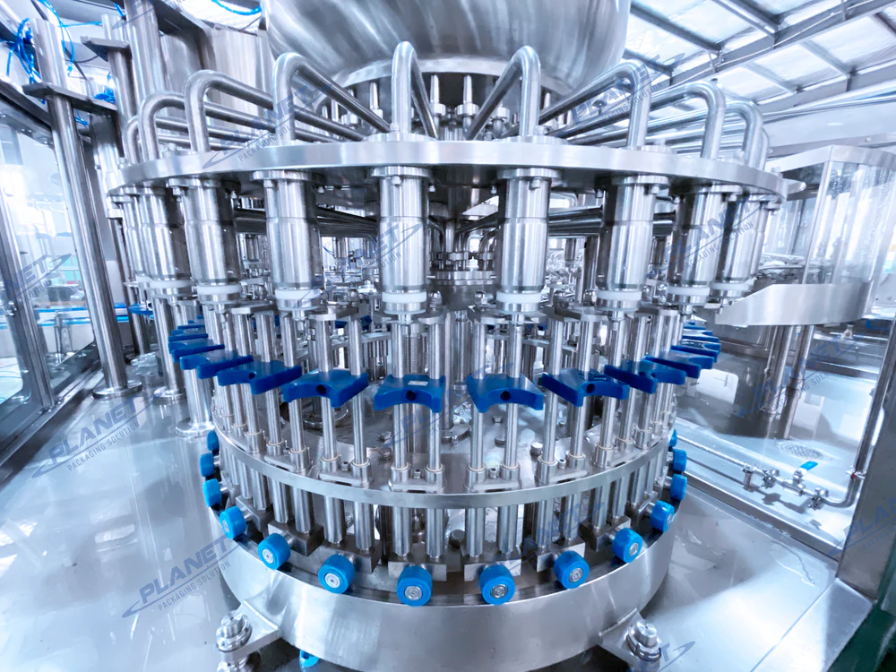 Close view of the rotary hot-fill valve carousel