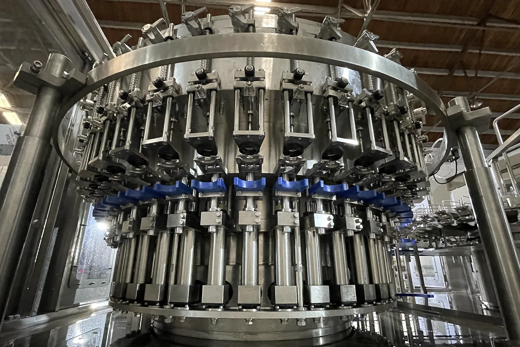 PET bottle counter-pressure filling valves used as a process illustration